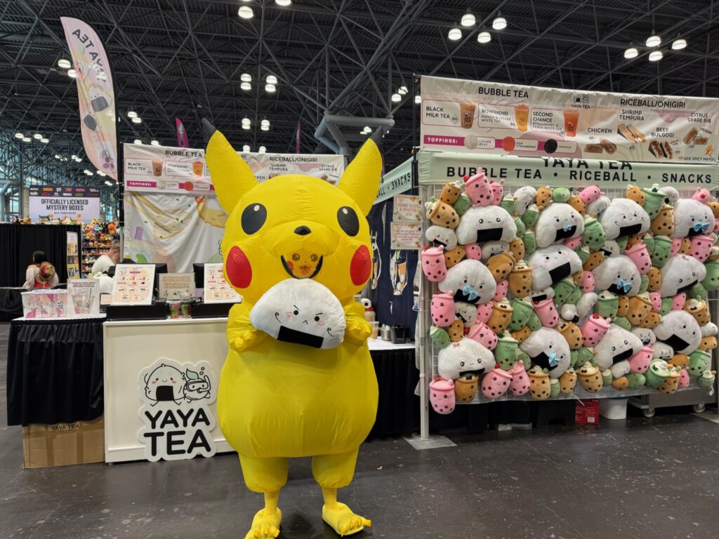 Pikachu Cosplay at AnimeNYC in front of Yaya Tea Booth