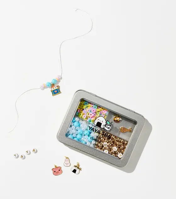 Yaya Tea x Claire's DIY bracelet kit with beads, charms, and letter beads spelling YAYA